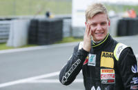 Van Ammersfoort Formula Four driver Mick Schumacher of Germany smiles as he leaves the pitlane after the second race of the ADAC F4 season at the Motorsport Arena in Oschersleben, Germany, April 26, 2015. REUTERS/Hannibal Hanschke