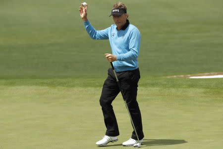 Bernhard Langer of Germany holds his ball on the second green in first round play during the 2017 Masters golf tournament at Augusta National Golf Club in Augusta, Georgia, U.S., April 6, 2017. REUTERS/Jonathan Ernst