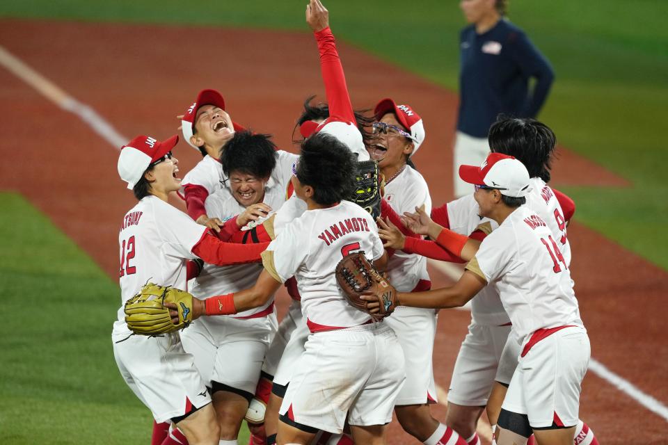 Japan celebrates winning the gold medal.