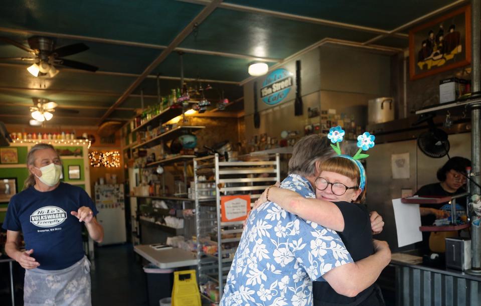 Heidi Yoxsimer gets a hug from long-time customer Leif Bentsen at Hi-Lo's 15th Street Cafe in Bremerton on Saturday, Aug. 26, 2023.