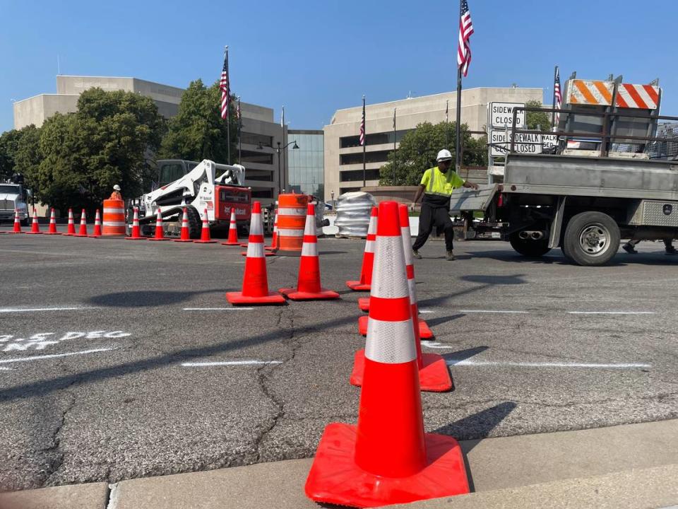 Orange pylons are lined up across the northeast corner of the Public Square in downtown Belleville with the St. Clair County Building in the background. Work began Tuesday to demolish portions of the road service and replace about 1,700 feet of aging water main.