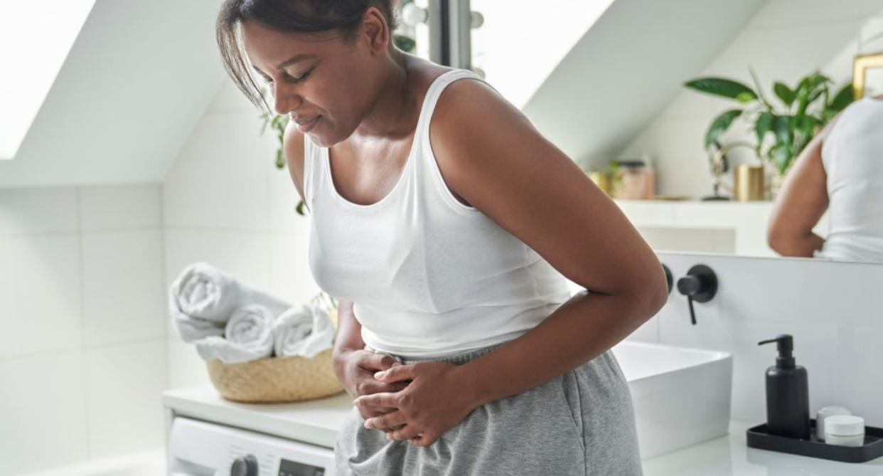 Woman with stomach cramps, to represent Shigella STI. (Getty Images)