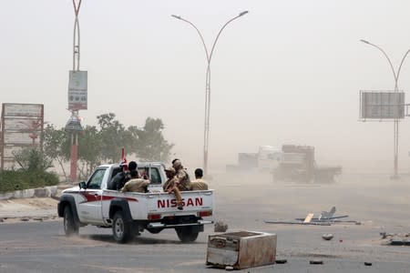 FILE PHOTO: Members of UAE-backed southern Yemeni separatist forces patrol a road during clashes with government forces in Aden, Yemen