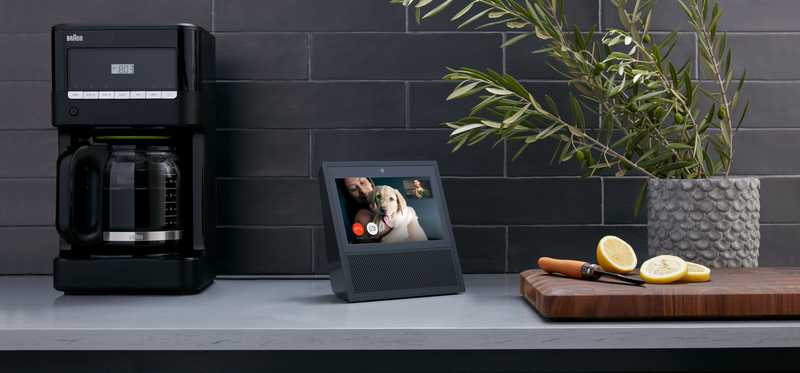 An Alexa device on a kitchen countertop.