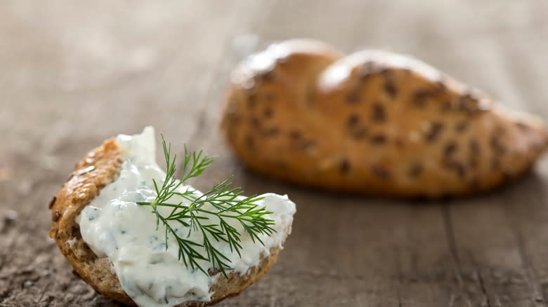 Hunk of bagel with tzatziki