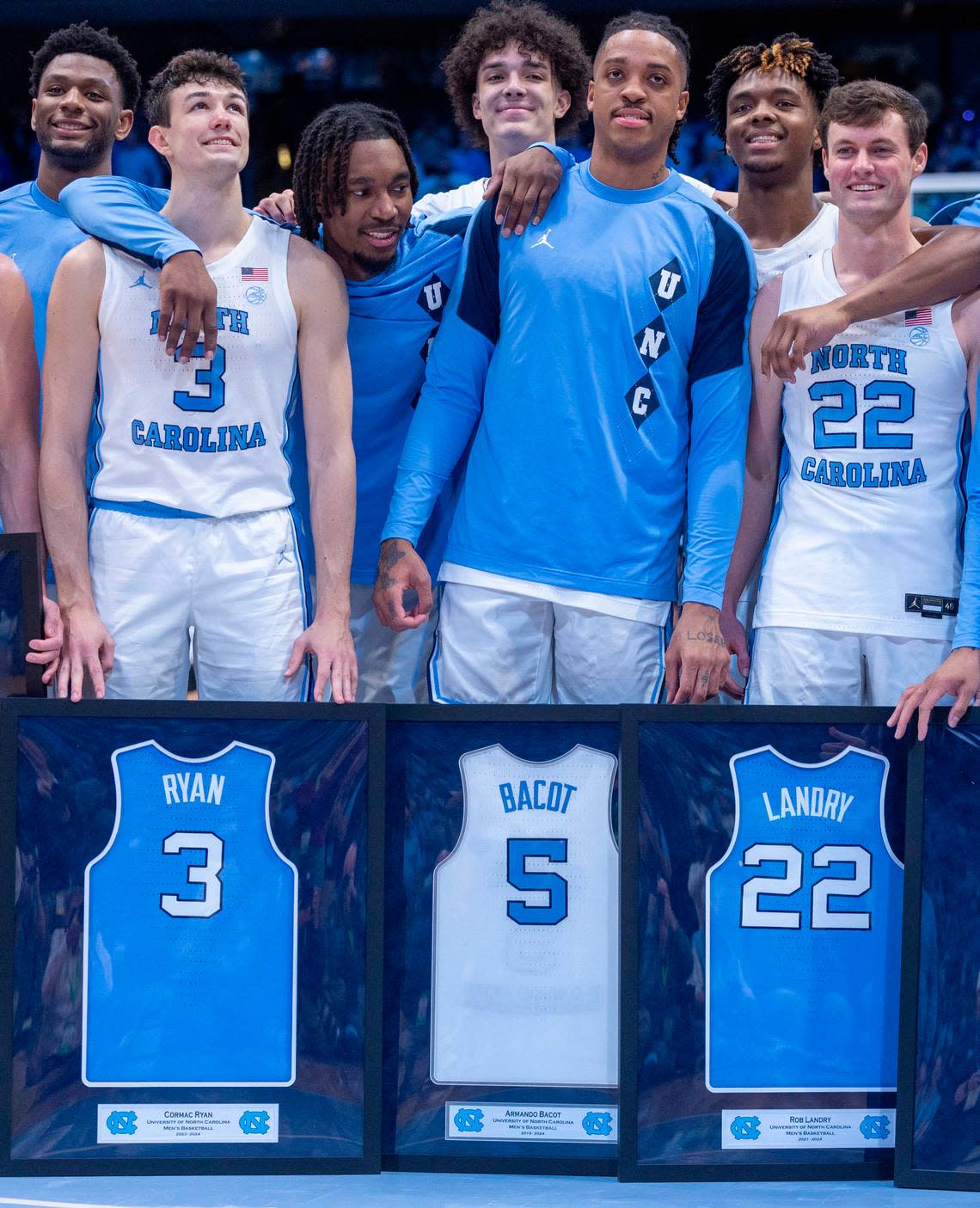 North Carolina’s Armando Bacot (5) is surrounded by teammates as he and other seniors including Cormac Ryan and Rob Landry (22) are honored prior to their final home game against Notre Dame on Tuesday, March 5, 2023 at the Smith Center in Chapel Hill, N.C.