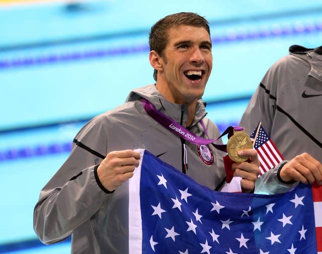 Michael Phelps celebrates after winning the men's 4x200m freestyle relay final