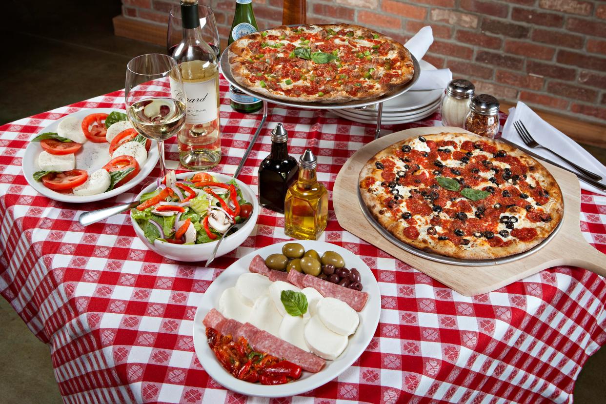 A Caprese salad, charcuterie, salads and pizzas are on the menu at Grimaldi's.