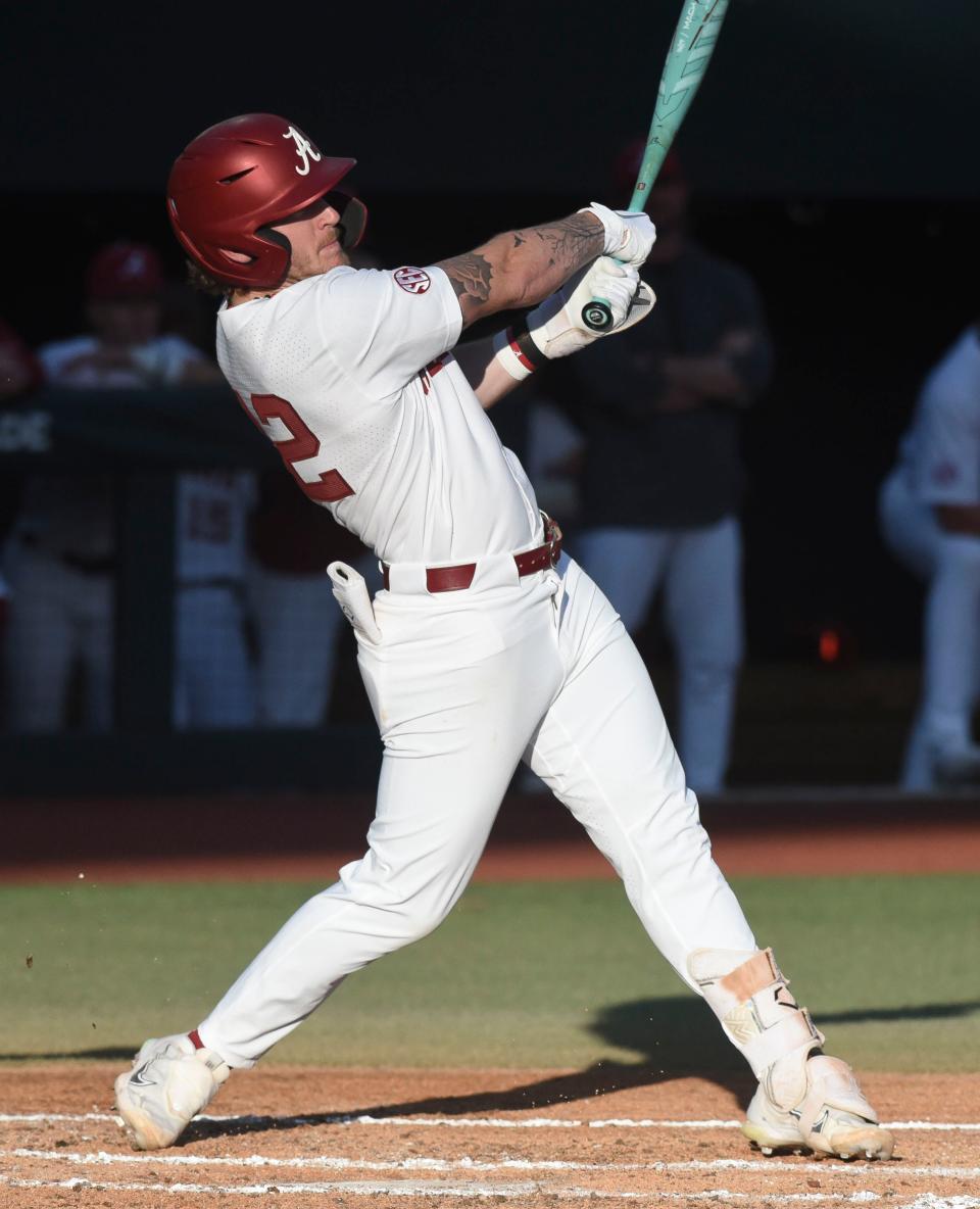 Feb 23, 2024; Tuscaloosa, Alabama, USA; Alabama batter Gage Miller (12) connects for a three run homer during the opening game of the weekend series with Valparaiso at Sewell-Thomas Stadium.