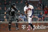 Jul 13, 2018; Atlanta, GA, USA; Atlanta Braves left fielder Ronald Acuna Jr. (13) reacts after striking out as Arizona Diamondbacks catcher Alex Avila (5) is shown on the play in the ninth inning at SunTrust Park. Mandatory Credit: Jason Getz-USA TODAY Sports