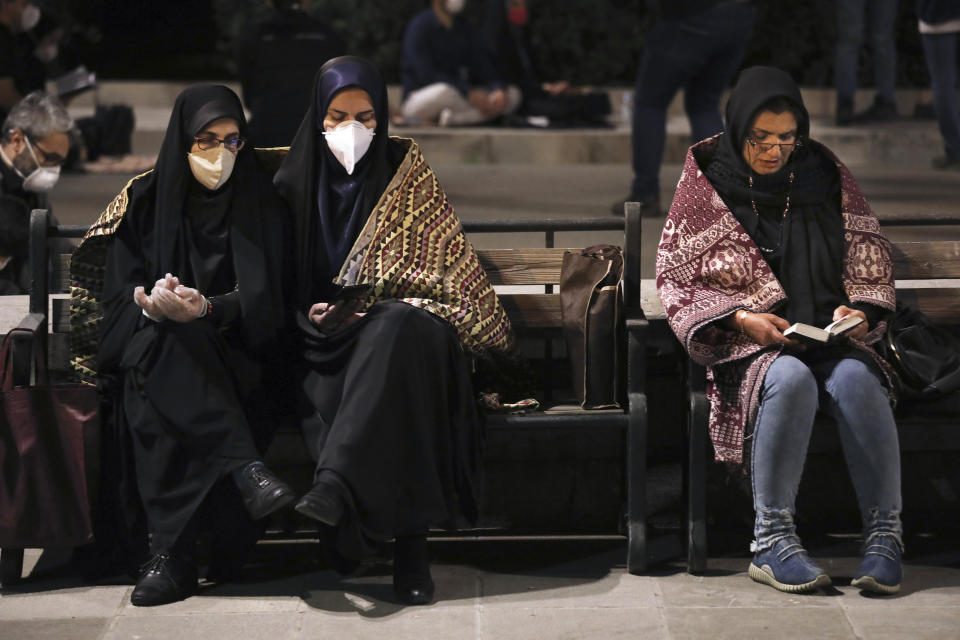 Worshippers, some of them wearing protective face masks to help prevent the spread of the coronavirus, pray outside the mosque of the Tehran University in Laylat al-Qadr, or the night of destiny, during holy fasting month of Ramadan, Iran, Tuesday, May 12, 2020. On Tuesday authorities allowed mosques temporarily reopen for limited hours up, while strictly observing health and social procedures to prevent spreading the disease. (AP Photo/Vahid Salemi)