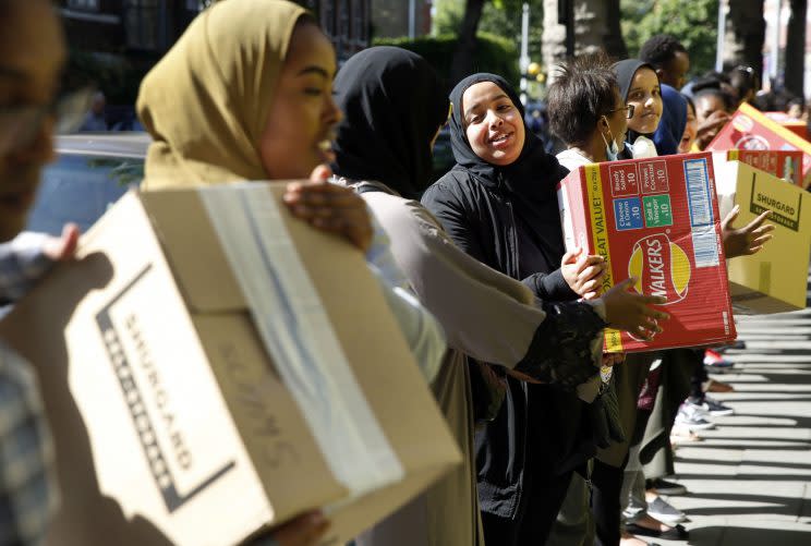 Women help deliver emergency food parcels (RexHe demanded that criminal action needed to be taken.