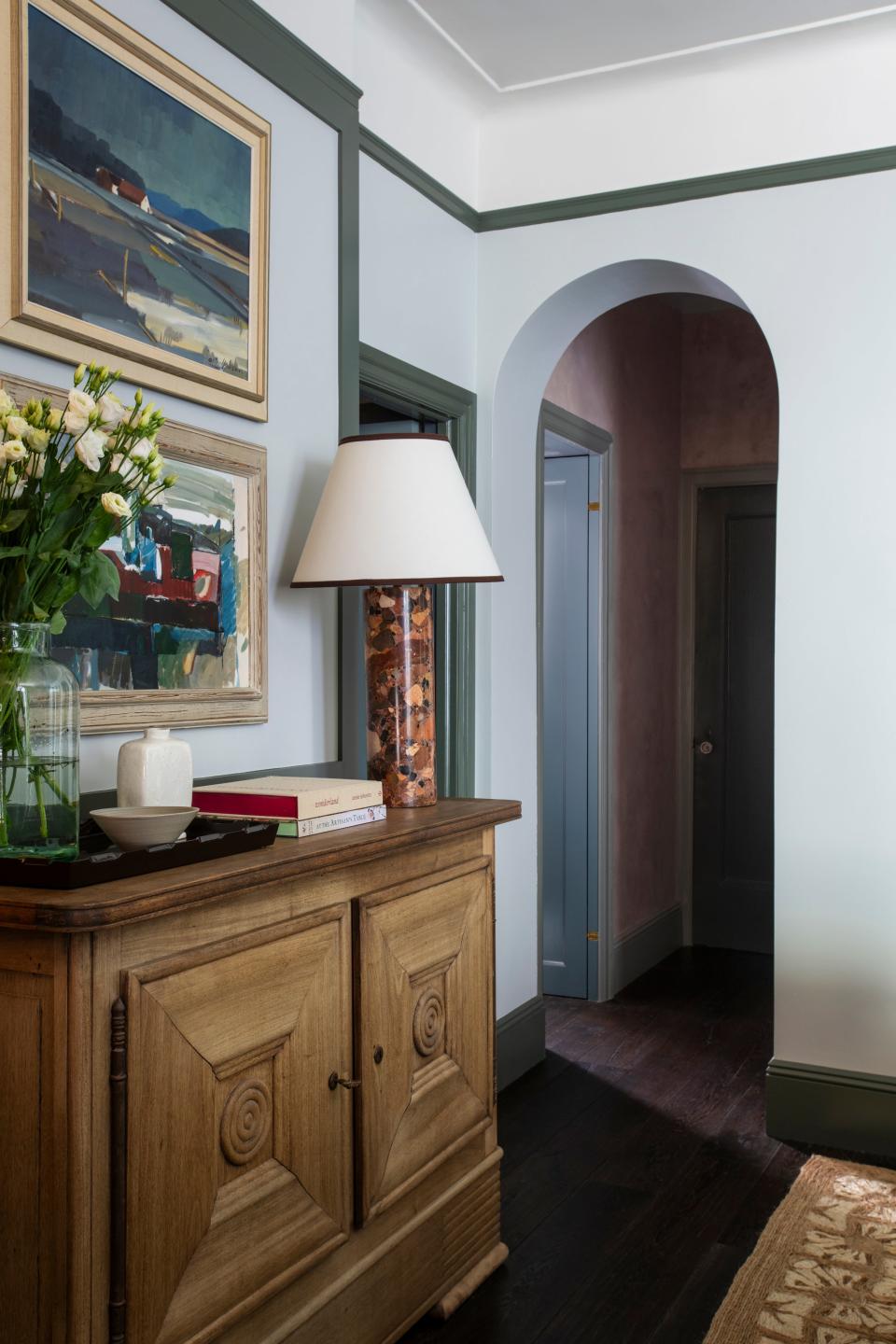 AFTER: Louise considers the 1940s Charles Dudouyt console the tour de force of the living room. “Its laid-back beauty sets the tone for the entire apartment,” she says.