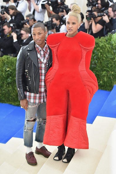 Pharrell Williams and Helen Lasichanh at the "Rei Kawakubo/Comme des Garcons: Art Of The In-Between" Costume Institute Gala.