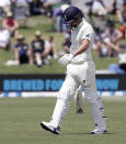 England's Sam Curran walks from the field after he was dismissed for no score during play on day two of the first cricket test between England and New Zealand at Bay Oval in Mount Maunganui, New Zealand, Friday, Nov. 22, 2019. (AP Photo/Mark Baker)