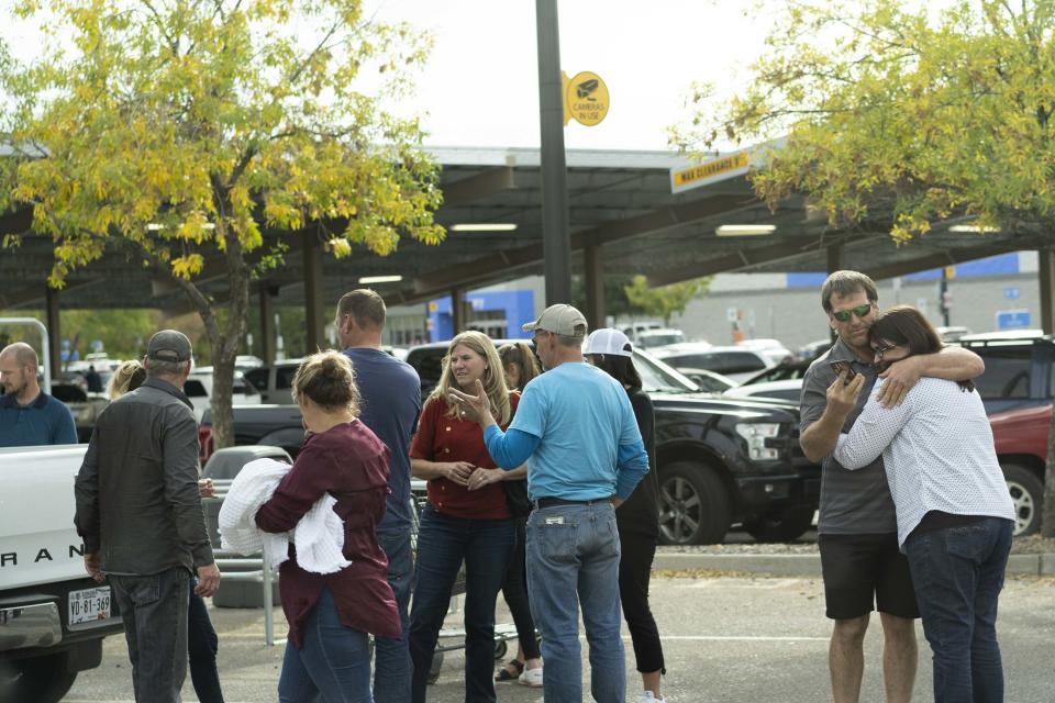 Dozens of relatives of nine women and children ambushed and killed in Mexico meet on Nov. 6, 2019, at the Walmart in Douglas, just a few feet from the U.S.-Mexico border. They came from all over the United States as they prepared to travel to the town of La Mora, Sonora, where many of them were born or grew up.