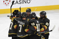 Vegas Golden Knights left wing Max Pacioretty (67) celebrates his goal with teammates during the third period in Game 5 of an NHL hockey Stanley Cup semifinal playoff series against the Montreal Canadiens Tuesday, June 22, 2021, in Las Vegas. (AP Photo/David Becker)