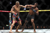 Alex Pereira, left, fights Jamahal Hill during a UFC 300 mixed martial arts light heavyweight bout Saturday, April 13, 2024, in Las Vegas. (Ellen Schmidt/Las Vegas Review-Journal via AP)