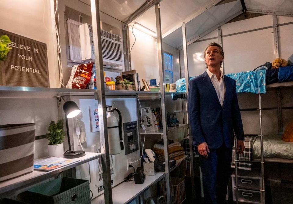 Gov. Gavin Newsom tours a tiny home after announcing on March 16 that the state will have 1,200 tiny homes built and delivered throughout California in an effort to help house the homeless population.