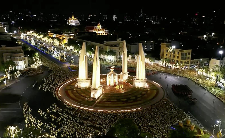 In this photo made from video, an aerial scene shows Thailand’s King Maha Vajiralongkorn street procession wind around the Democracy Monument during the second day of his coronation ceremony in Bangkok, Sunday, May 5, 2019. Vajiralongkorn was officially crowned Saturday amid the splendor of the country's Grand Palace, taking the central role in an elaborate centuries-old royal ceremony that was last held almost seven decades ago. (Thai TV Pool via AP)