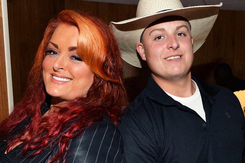 <p>Rick Diamond/Getty</p> Wynonna Judd with her son Elijah in 2013.