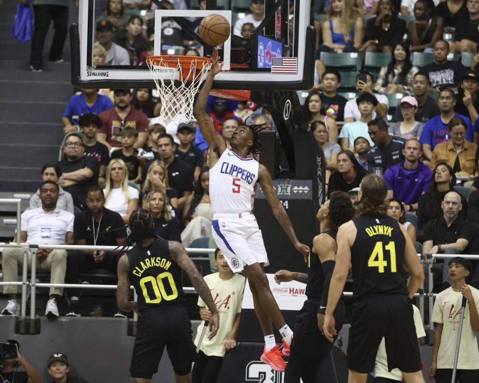 Clippers guard Bones Hyland scores on a layup against the Utah Jazz on Sunday.