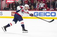 Dec 14, 2018; Raleigh, NC, USA; Washington Capitals left wing Jakub Vrana (13) scores the game winning shootout goal against the Carolina Hurricanes at PNC Arena. The Capitals defeated the Hurricanes 6-5 in a shootout. Mandatory Credit: James Guillory-USA TODAY Sports