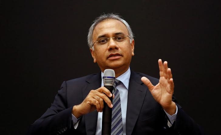 Infosys Chief Executive Officer Salil S. Parekh gestures as addresses the media during the announcement of the company's quarterly results at its headquarters in Bengaluru