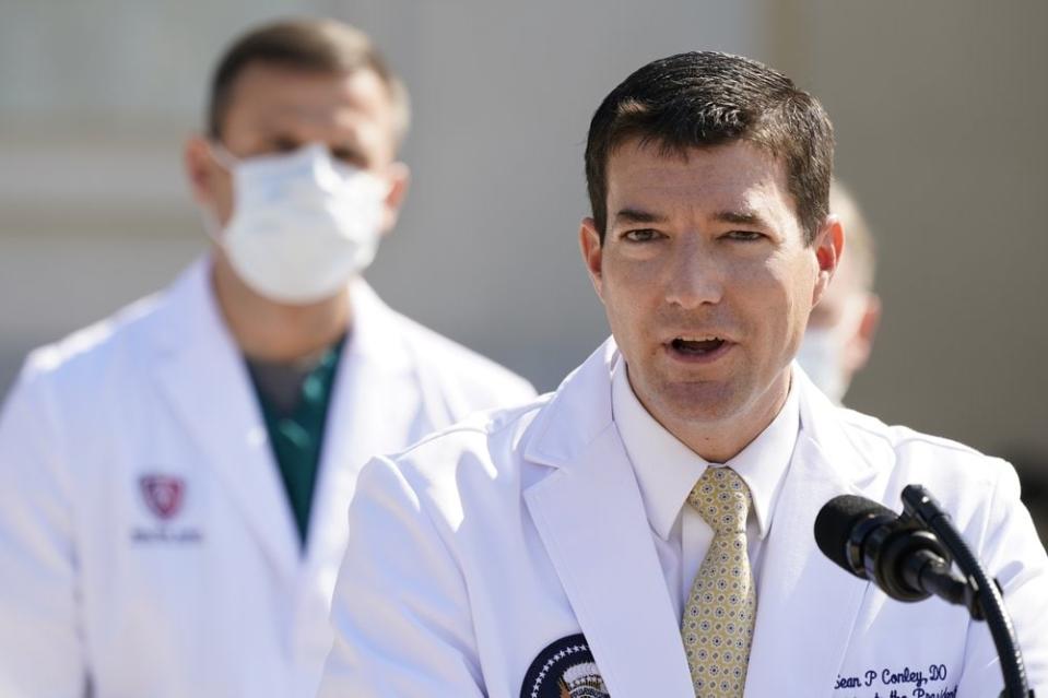Dr. Sean Conley, physician to President Donald Trump, briefs reporters at Walter Reed National Military Medical Center in Bethesda, Md., Sunday, Oct. 4, 2020. Trump was admitted to the hospital after contracting the coronavirus. (AP Photo/Jacquelyn Martin)