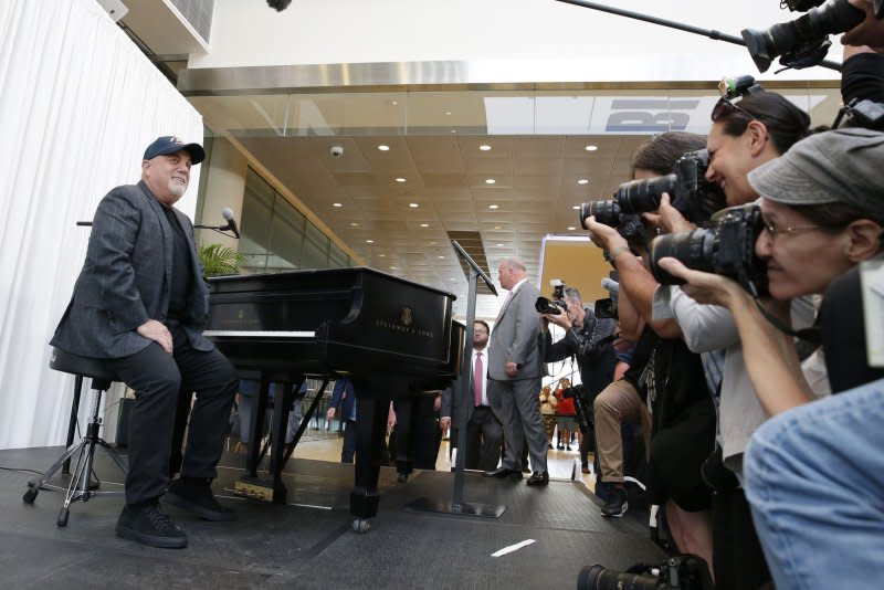 Billy Joel sits at a piano that will be a permanent fixture at MSG after a press conference marking Joel's unprecedented achievement of 100 lifetime performances at the venue in New York City in 2018. File Photo by John Angelillo/UPI