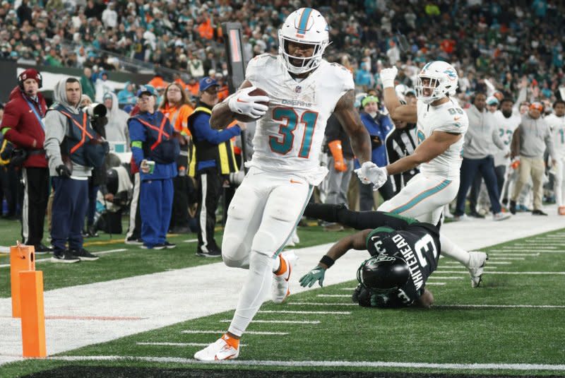 Miami Dolphins running back Raheem Mostert scores a touchdown run against the New York Jets on Friday at MetLife Stadium in East Rutherford, N.J. File Photo by John Angelillo/UPI