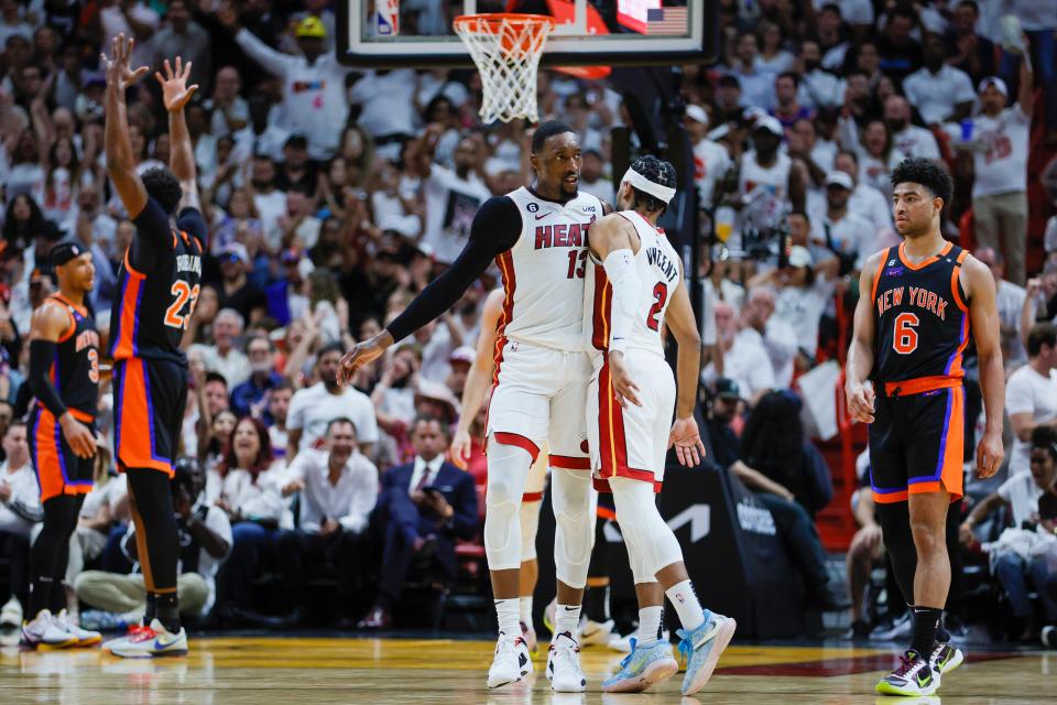 May 8, 2023; Miami, Florida, USA; Miami Heat center Bam Adebayo (13) celebrates with guard Gabe Vincent (2) after scoring against the New York Knicks in the second quarter during game four of the 2023 NBA playoffs at Kaseya Center. Mandatory Credit: Sam Navarro-USA TODAY Sports