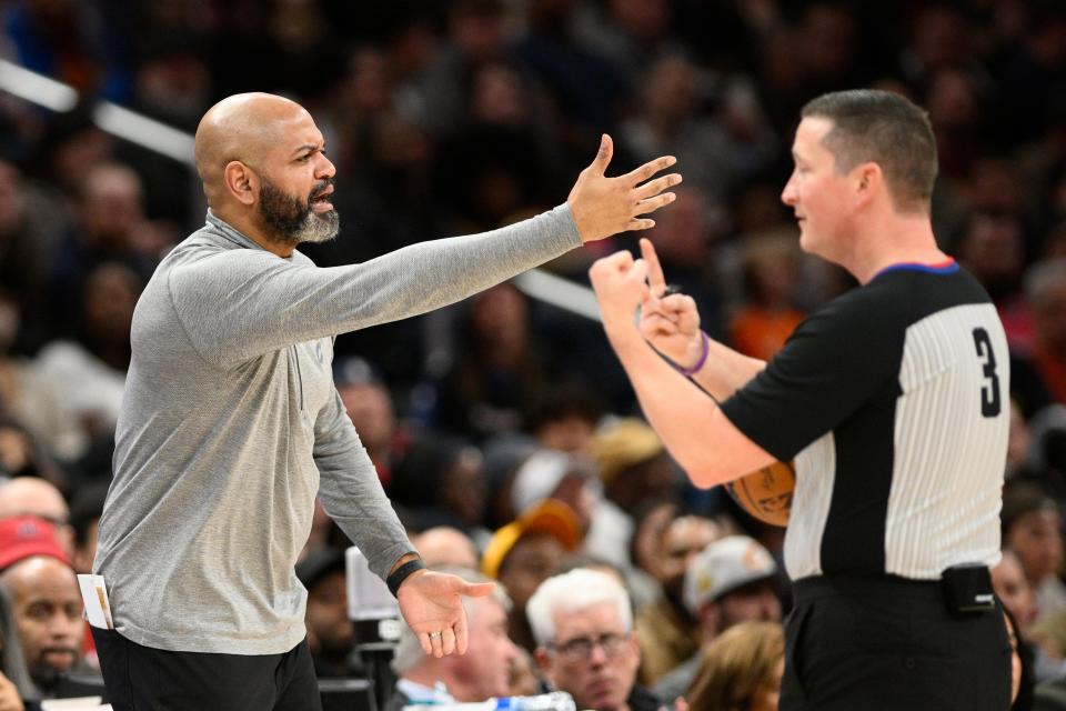 Cleveland Cavaliers head coach J.B. Bickerstaff, left, gestures next to referee Nick Buchert (3) during the first half of an NBA basketball game against the Washington Wizards, Monday, Feb. 6, 2023, in Washington. (AP Photo/Nick Wass)