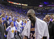 FILE - In this May 21, 2012 file photo Los Angeles Lakers guard Kobe Bryant (24) walks off the court in Game 5 of an NBA basketball Western Conference semifinal playoff series game against the Oklahoma City Thunder in Oklahoma City. Bryant, the 18-time NBA All-Star who won five championships and became one of the greatest basketball players of his generation during a 20-year career with the Los Angeles Lakers, died in a helicopter crash Sunday, Jan. 26, 2020. He was 41. (AP Photo/Alonzo Adams, file)