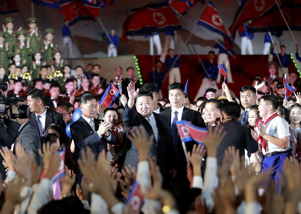 This photo provided by the North Korean government shows North Korean leader Kim Jong Un, center, waves to the participants during a celebration marking the nation's 74th anniversary in Pyongyang, North Korea, on Sept. 8, 2022. Independent journalists were not given access to cover the event depicted in this image distributed by the North Korean government. The content of this image is as provided and cannot be independently verified. Korean language watermark on image as provided by source reads: "KCNA" which is the abbreviation for Korean Central News Agency. (Korean Central News Agency/Korea News Service via AP)