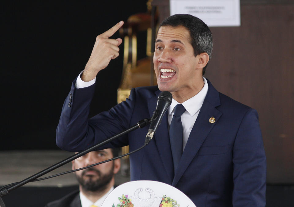 Opposition leader and self-proclaimed interim president of Venezuela Juan Guaido, speaks to during a session in a main square in Caracas, Venezuela, Tuesday, July 23, 2019. The opposition-led congress held the session to try to keep pressure on the government of President Nicolás Maduro, who has defied U.S.-led efforts to oust him. Guaido said, as he often has in the past, that the government he calls a "dictatorship" is crumbling. (AP Photo/Leonardo Fernandez)