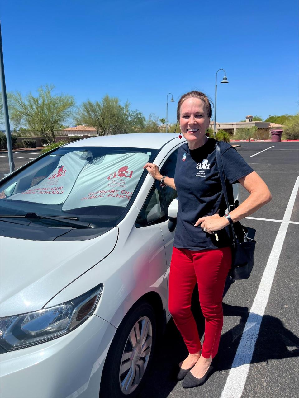 Retired Scottsdale middle school teacher and Scottsdale Unified School District Board President Julie Cieniawski wore an Arizona Education Association t-shirt to cast her ballot at the Islamic Center of the Northeast Valley in Scottsdale.