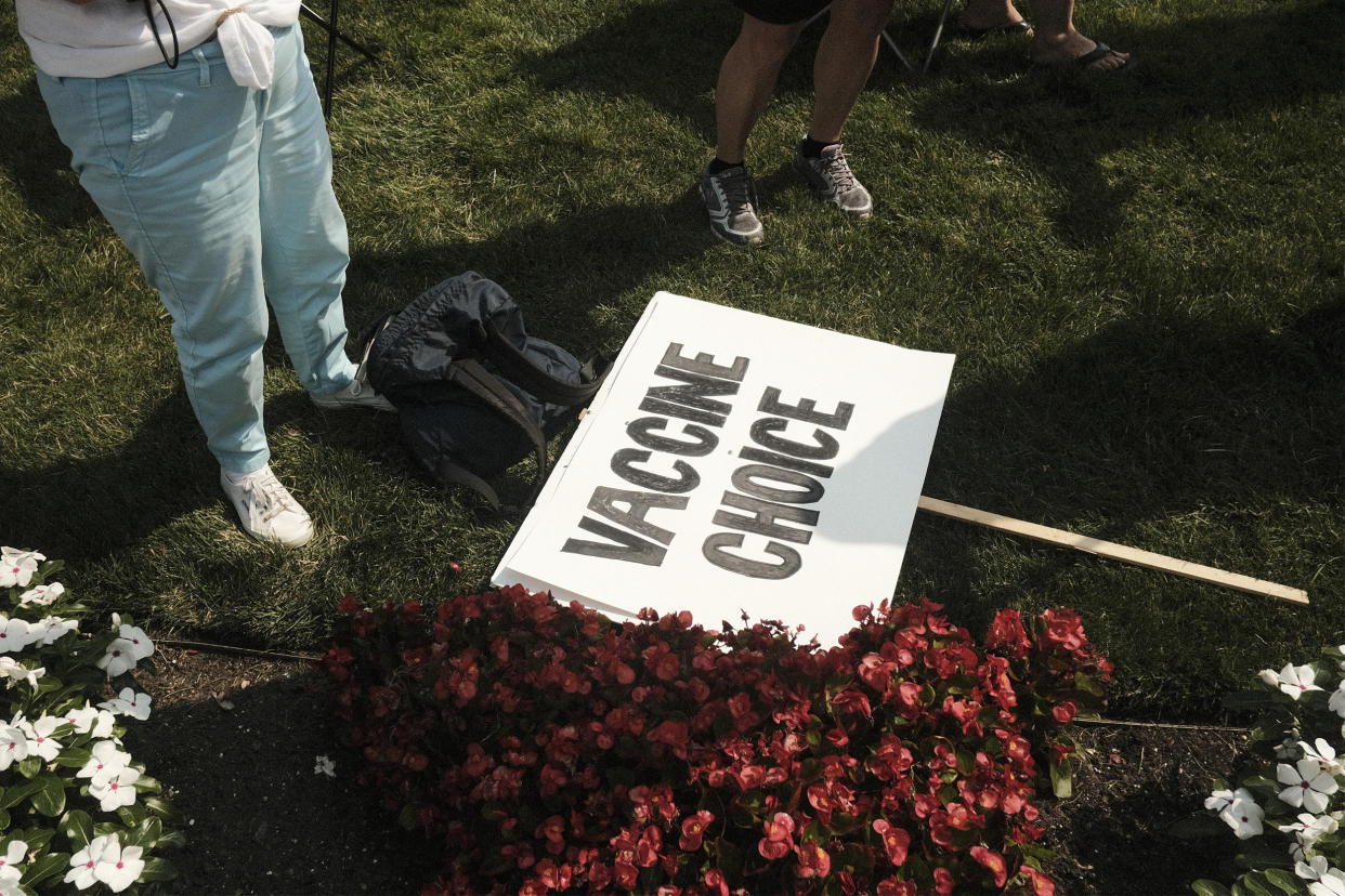 A sign during a protest against Covid-19 vaccination mandates in Lansing, Michi., on Aug. 6, 2021. (Matthew Hatcher / Bloomberg via Getty Images file)