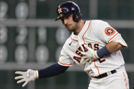 Houston Astros' Alex Bregman reacts after hitting a two-run double during the third inning of the team's baseball game against the Cleveland Guardians, Tuesday, May 24, 2022, in Houston. (AP Photo/Eric Christian Smith)