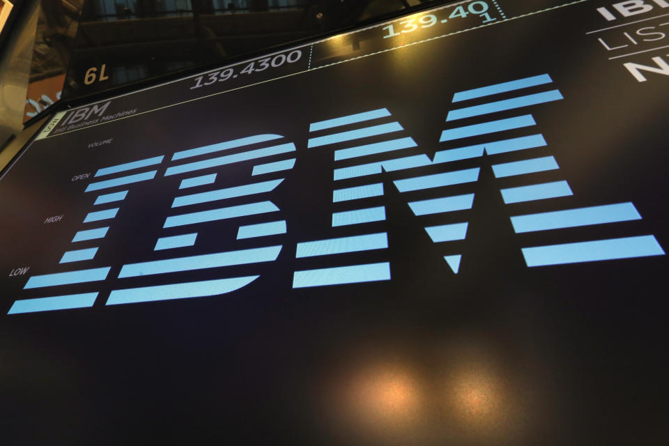 FILE - In this March 18, 2019, photo the logo for IBM appears above a trading post on the floor of the New York Stock Exchange. IBM reports reports financial results Wednesday, Oct. 16. (AP Photo/Richard Drew, File)