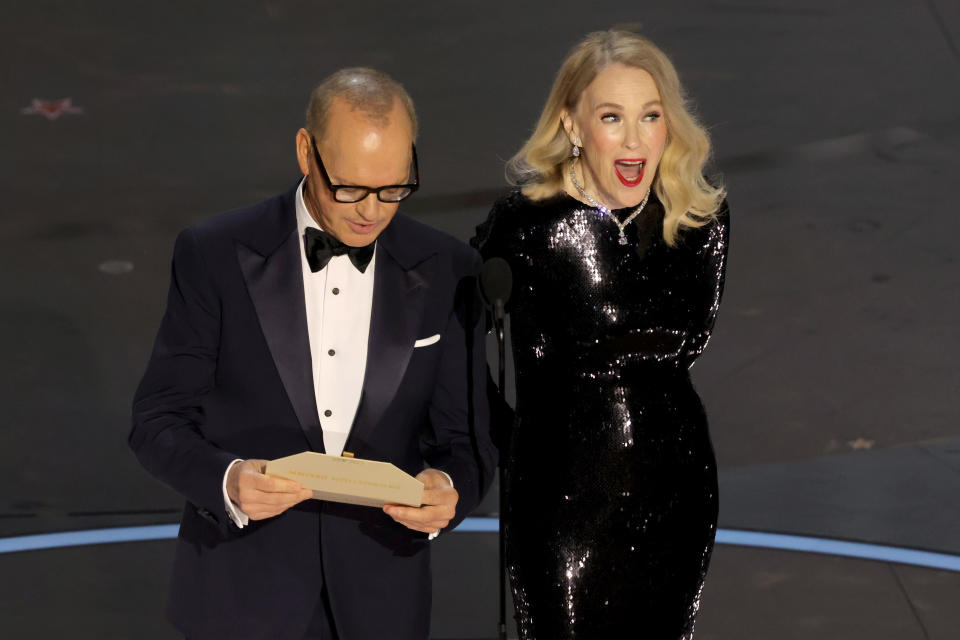 HOLLYWOOD, CALIFORNIA - MARCH 10: (L-R) Michael Keaton and Catherine O'Hara speak onstage during the 96th Annual Academy Awards at Dolby Theatre on March 10, 2024 in Hollywood, California. (Photo by Kevin Winter/Getty Images)