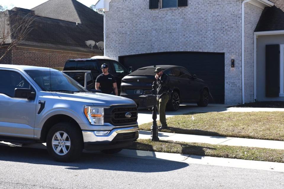 Agents search the home and vehicles at the home of Biloxi Councilman Robert Deming III Thursday. The Candy Shop and Kratom locations also were raided by Drug Enforcement Administration and local police. Hannah Ruhoff/hruhoff@sunherald.com