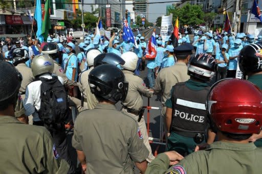 Cambodian demonstrators in Phnom Penh on Monday.April 30, 2012. After the chilling murder of a prominent activist and a recent spike in violence at land and labour disputes, observers say the message is clear: it's a dangerous time to be a protester in Cambodia