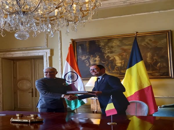 India's Ambassador to Belgium Santosh Jha signing agreement on mutual legal assistance in criminal matters with Belgium's Deputy Prime Minister Vincent Van Quickenborne.