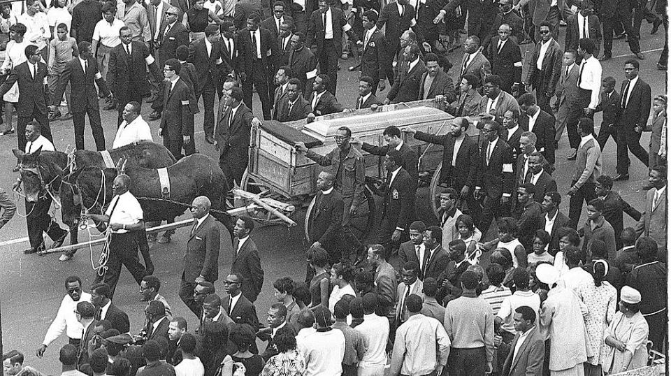 People march alongside Martin Luther King Jr casket