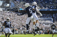 Penn State wide receiver Jahan Dotson (5) celebrates his first quarter touchdown pass with Theo Johnson (84) against Villanova during an NCAA college football game in State College, Pa., on Saturday, Sept.25, 2021. (AP Photo/Barry Reeger)