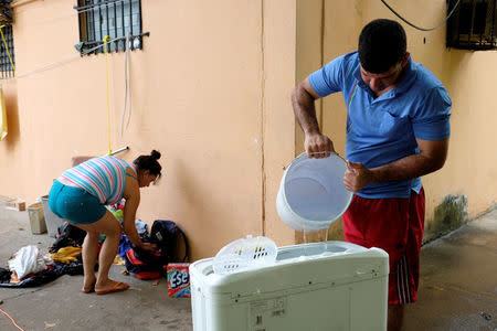 Cuban migrants do the laundry at the Caritas shelter for migrants in Panama City, Panama, January 13, 2017. REUTERS/Melchor Herrera