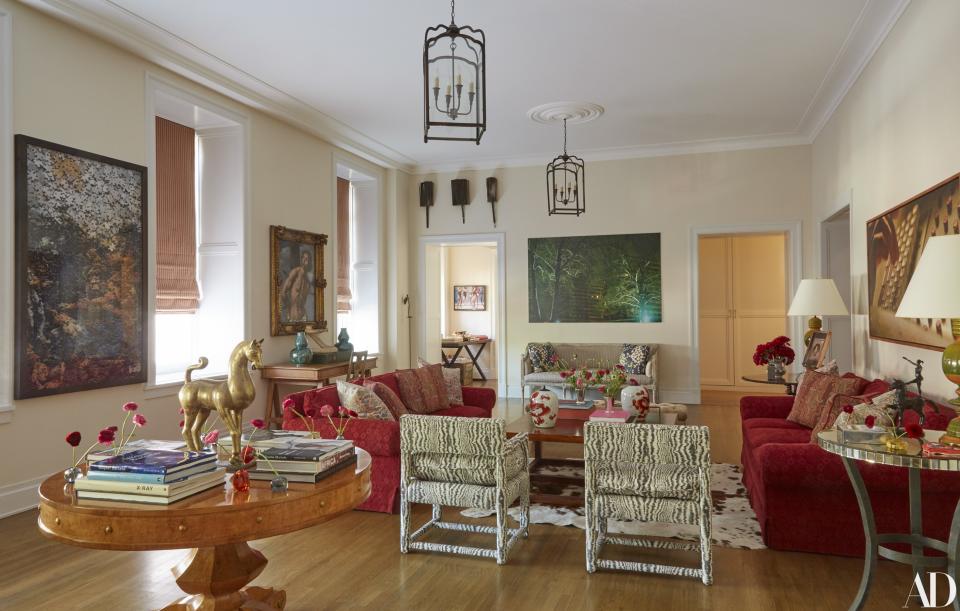 Artworks (from left) by Vik Muniz, 17th-century Italian school, Knut Åsdam, and Damian Loeb decorate the living room. Burl-wood table from Dessin Fournir; chairs by Meg Braff.