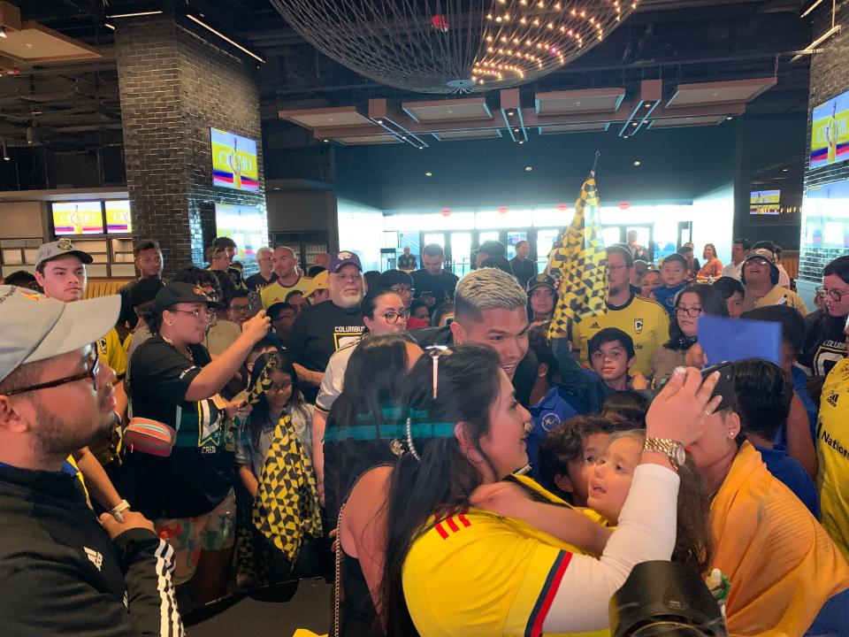 Columbus Crew forward Cucho Hernandez poses for photos with fans at a welcoming event at Lower.com Field.