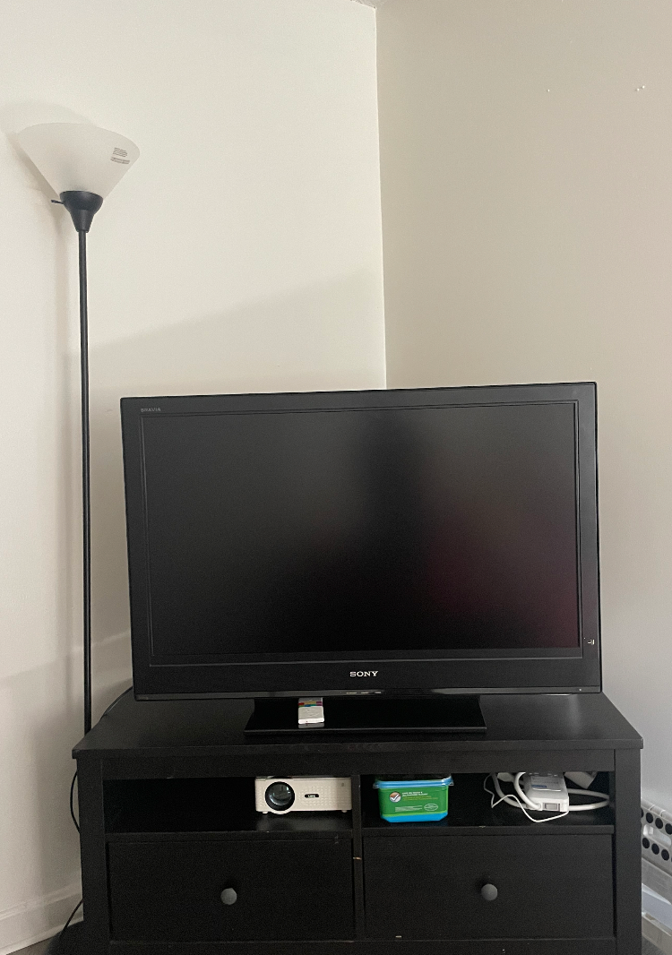TV given to me by an old renter and a TV stand my roommate found on Facebook Marketplace